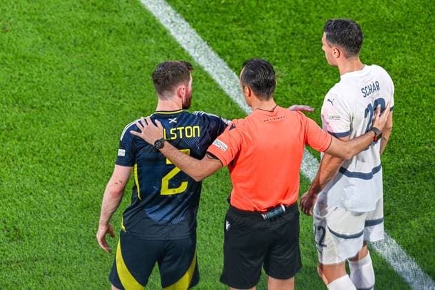 240619 EURO2024 SCOTLAND VS SWITZERLAND 4th official Irfan Peljto , Anthony Ralston (2) of Scotland and Fabian Schar (22) of Switzerland during a soccer game between the national teams of Scotland and Switzerland on the 2nd matchday in Group A in the group stage of the UEFA EURO, EM, Europameisterschaft,Fussball 2024 tournament , on Wednesday 19 June 2024 in Cologne , Germany . PHOTO SPORTPIX Stijn Audooren Cologne Cologne Stadium Germany  Copyright: xSportpix.bex xStijnxAudoorenxStijnxAudoorenx