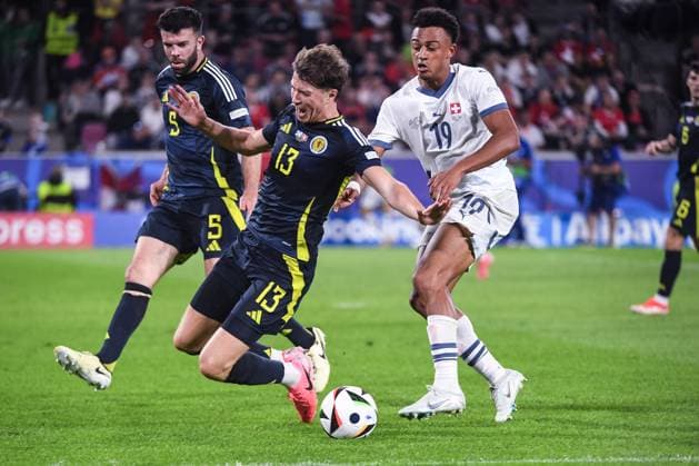 COLOGNE, GERMANY JUNE 19 Dan Ndoye of Switzerland R against Jack Hendry of Scotland L during the UEFA EURO 2024 group stage match between Scotland and Switzerland at Cologne Stadium on June 19, 2024 in Cologne, Germany Cologne Cologne Stadium North Rhine Westphalia Germany Copyright: xJustPictures.ch ManuelxWinterbergerx jp-en-EuSpIm-JP4_MAN_Scotland_Swiss_19Jun2024_CO_00035