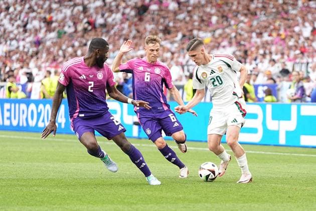 Antonio Rüdiger 2 Germany , Joshua Kimmich 6 Germany and Roland Sallai 20 Hungary in action during the 2nd group match of the European Championship Germany Hungary on 19 06 2024 Stuttgart Stuttgart Arena Baden Württemberg Germany