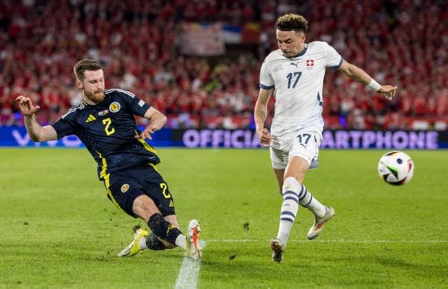 19th June 2024; Cologne Stadium, Cologne, Germany; Euro 2024 Group A Football, Scotland versus Switzerland; Anthony Ralston (SCO) crosses past Ruben Vargas (SUI)  ActionPlus12657105 FotoxOlimpik