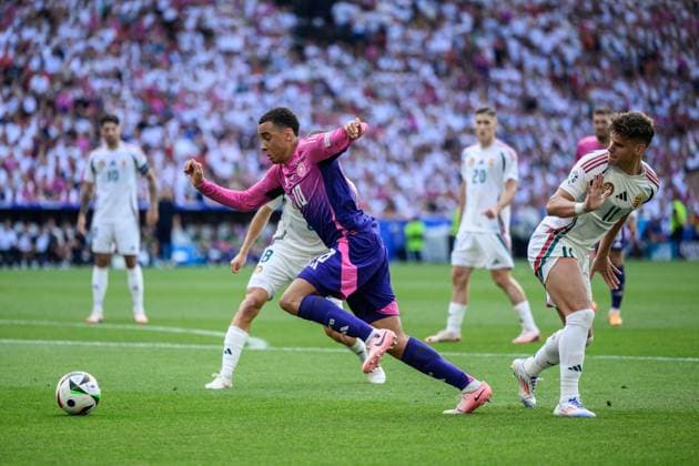 240619 Jamal Musiala of Germany and Milos Kerkez of Hungary during the UEFA Euro 2024 Football Championship match between Germany and Hungary on June 19, 2024 in Stuttgart Photo Jesper Zerman BILDBYRAN kod JZ JZ0542 fotboll football soccer fotballs em europamästerskap em uefa euro uefa european football championship euro 2024 tyskland germany hungary bbeng  Copyright: JESPERxZERMAN BB240619JZ225