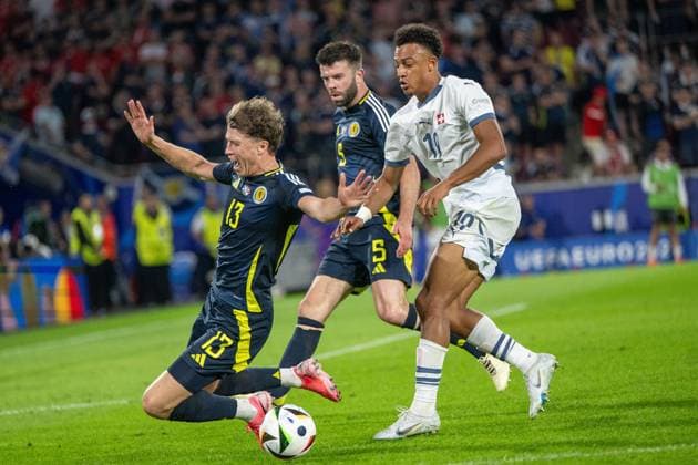 GER, EURO 2024, Group A, Scotland SCT vs Switzerland SUI 19 06 2024, Cologne Stadium, Cologne, GER, EURO 2024, Group A, Scotland SCT vs Switzerland SUI In the picture Dan Ndoye Switzerland SUI, 19 brings down Jack Hendry Scotland SCT, 13 in a duel, duel, dynamics, action, action, game scene gestures, facial expressions, emotions nordphotoxGmbHxx xDenkinger nph00015