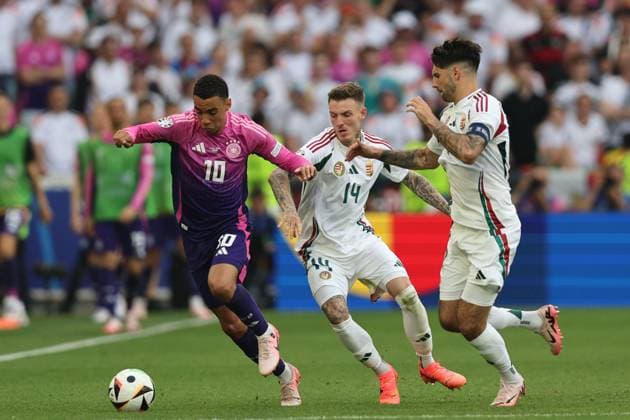 Jamal Musiala (Germany)Bendeguz Bolla (Hungary)Dominik Szoboszlai (Hungary) during the UEFA EURO, EM, Europameisterschaft,Fussball Germany 2024 match between Germany 2-0 Hungary at Stuttgart Arena on June 19, 2024 in Stuttgart, Germany. Noxthirdxpartyxsales  (256971022)