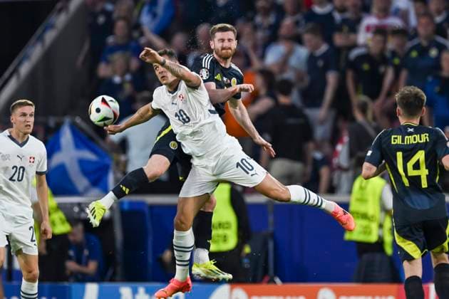 Granit Xhaka (Switzerland)Anthony Ralston (Scotland) during the UEFA EURO, EM, Europameisterschaft,Fussball Germany 2024 match between Switzerland 1-1 Scotland at Cologne Stadium on June 19, 2024 in Cologne, Germany. Noxthirdxpartyxsales  (256971424)