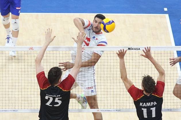 PH: Germany outguns France in VNL 2024 Match Yacine Louati 19, White of France spikes the ball towards two German players during their VNL Match. Pasay City Metro Manila Philippines Copyright: DennisxJeromexAcosta