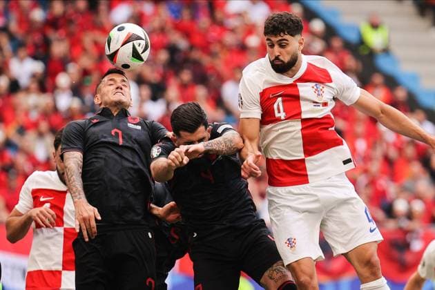 June 19, 2024, Hamburg, Germany: JoÅ¡ko Gvardiol (R) of Croatia, Rey Manaj (L) and Elseid Hysaj (C) of Albania seen in action during the UEFA EURO, EM, Europameisterschaft,Fussball 2024 group stage match between Croatia and Albania at Volksparkstadion. Final score; Croatia 2:2 Albania. Hamburg Germany - ZUMAs197 20240619_aaa_s197_117 Copyright: xSergeixMikhailichenkox