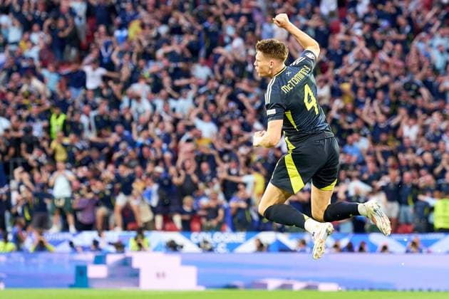 Scott McTominay of Scotland jumps in celebration of the first goal of the match during the UEFA EURO, EM, Europameisterschaft,Fussball 2024 group stage match between Scotland and Switzerland at Cologne Stadium on June 19, 2024 in Cologne, Germany. (Photo by Camilla Stolen Imago) Cologne Germany Copyright: xCamillaxStolenx L2120312 2A