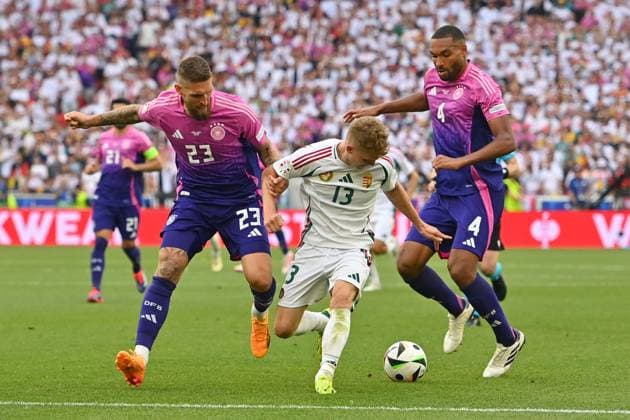 from left Robert Andrich GER , Andras SCHAEFER HUN , Jonathan Tah GER , action,duel group phase group A Germany GER Hungary HUN 2 0 on 19 06 2024, Stuttgart Arena Football UEFA EURO 2024 GERMANY from 14 06 2024 14 07 2024
