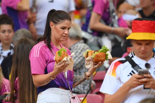 Lina KIMMICH wife of Joshua KIMMICH carries two burgers,player wife group phase group A Germany GER Hungary HUN 2 0 on 19 06 2024, Stuttgart Arena Football UEFA EURO 2024 GERMANY from 14 06 2024 14 07 2024