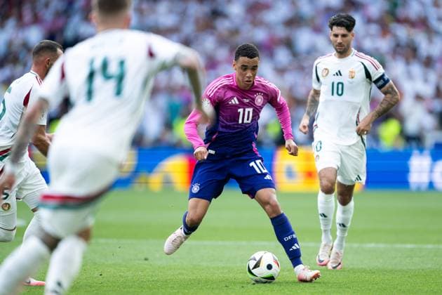 Jamal Musiala Germany, 10 on the ball, in front Bendeguz Bolla Hungary, 14 , behind Dominik Szoboszlai Hungary, 10 , GER, Germany GER vs Hungary HUN , European Football Championship, UEFA EURO 2024, Group A, Matchday 2, 19 06 2024 GER, Germany GER vs Hungary HUN , European Football Championship, UEFA EURO 2024, Group A, Matchday 2, 19 06 2024 Stuttgart Copyright: xEibner-Pressefoto Memmlerx EP_MMR