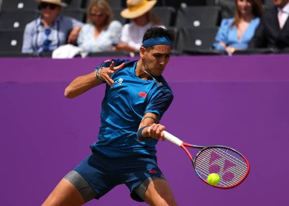 20th June 2024; Cinch Championships, Queens Club, West Kensington, London, England: Cinch Championships Queens Club, Day 4; Alejandro TABILO (CHI) with a forehand shot to Tommy PAUL (USA), mens singles match  ActionPlus12657176 JohnxPatrickxFletcher