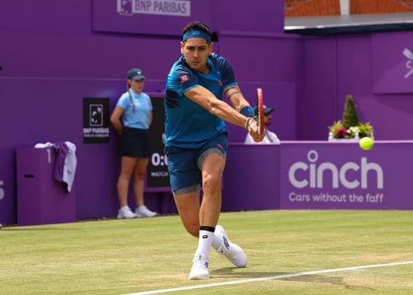 20th June 2024; Cinch Championships, Queens Club, West Kensington, London, England: Cinch Championships Queens Club, Day 4; Alejandro TABILO (CHI) with a backhand shot to Tommy PAUL (USA), mens singles match  ActionPlus12657180 JohnxPatrickxFletcher
