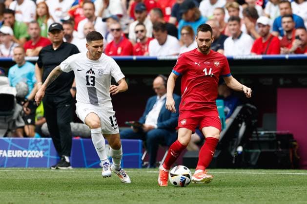 MUNCHEN, 20-06-2024, Allianz Arena. European Football Championship Euro2024, Group stage match no.18 between Slovenia and Serbia, Slovenia player Erik Janza, Serbia player Andrija Zivkovic Slovenia - Serbia (Euro2024)  x25540698x Copyright: