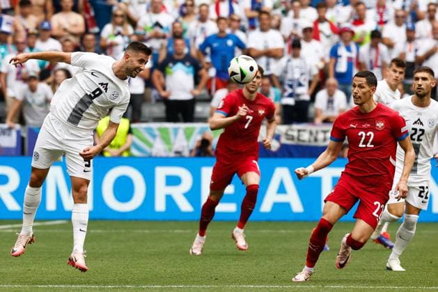 MUNCHEN, 20-06-2024, Allianz Arena. European Football Championship Euro2024, Group stage match no.18 between Slovenia and Serbia, Slovenia player Andrez Sporar, Serbia player Sasa Lukic Slovenia - Serbia (Euro2024)  x25540718x Copyright: