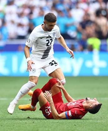 Adam Gnezda Cerin of Slovenia and Filip Mladenovic of Serbia Slovenia v Serbia, UEFA European Championship, EM, Europameisterschaft 2024, Group C, Football, Munich Football Arena, Munich, Germany, 20 Jun 2024 EDITORIAL USE ONLY No use with unauthorised audio, video, data, fixture lists, club league logos or live services. Online in-match use limited to 120 images, no video emulation. No use in betting, games or single club league player publications. Copyright: xMichaelxZemanek Shutterstockx 14543659al