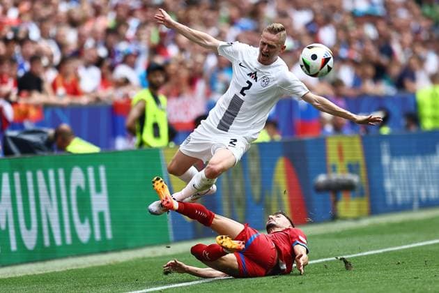 Zan Karnicnik of Slovenia is fouled by Filip Mladenovic of Serbia Slovenia v Serbia, UEFA European Championship, EM, Europameisterschaft 2024, Group C, Football, Munich Football Arena, Munich, Germany, 20 Jun 2024 EDITORIAL USE ONLY No use with unauthorised audio, video, data, fixture lists, club league logos or live services. Online in-match use limited to 120 images, no video emulation. No use in betting, games or single club league player publications. Copyright: xMichaelxZemanek Shutterstockx 14543659as