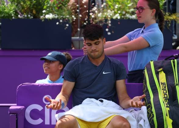 20th June 2024; Cinch Championships, Queens Club, West Kensington, London, England: Cinch Championships Queens Club, Day 4; Carlos Alcaraz (ESP) complaining to Umpire Mohamed Lahyani (SWE) about the ball kids on Centre Court during a break in the first set against Jack Draper (GBR), mens singles match  ActionPlus12657209 JohnxPatrickxFletcher