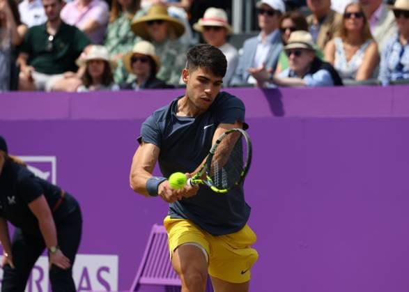 20th June 2024; Cinch Championships, Queens Club, West Kensington, London, England: Cinch Championships Queens Club, Day 4; Carlos Alcaraz (ESP) with a backhand shot to Jack Draper (GBR), mens singles match  ActionPlus12657210 JohnxPatrickxFletcher