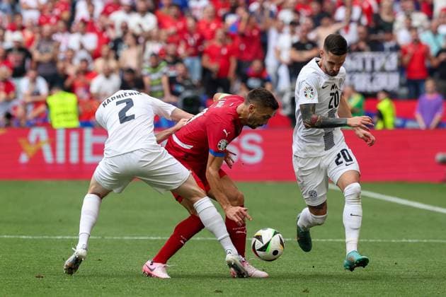 in duel, action, with Zan Karnicnik 2 Slovenia , Dusan Tadic 10 Serbia , Petar Stojanovic 20 Slovenia , Slovenia vs Serbia Football, UEFA Euro 2024, Group stage, Matchday 2, 20 06 2024 Munich Bavaria Germany Copyright: xkolbert-press ChristianxKolbertx
