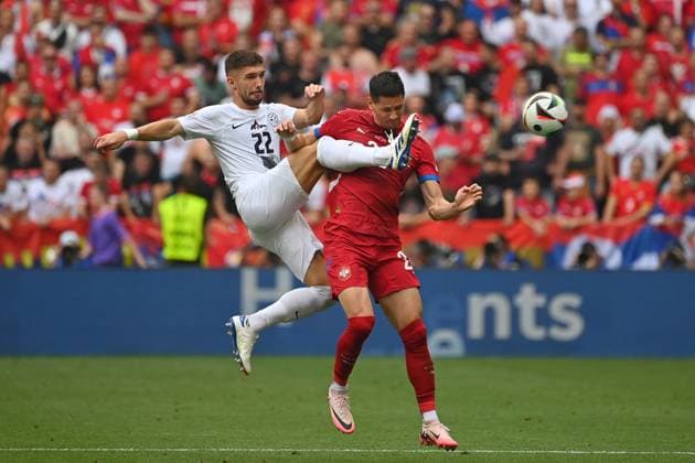Adam Gnezda CERIN SVN , action,duel against Sergej MILINKOVIC SAVIC SRB , group stage group C Slovenia SVN Serbia SRB on 20 06 2024, Football Arena Munich Football UEFA EURO 2024 GERMANY from 14 06 2024 14 07 2024