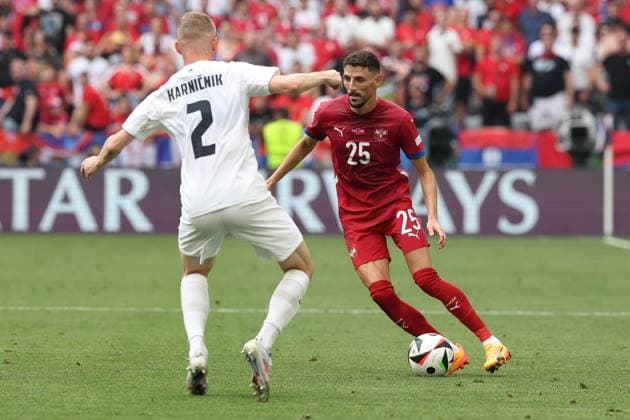 in duel, action, with Zan Karnicnik 2 Slovenia , Filip Mladenovic 25 Serbia , Slovenia vs Serbia Football, UEFA Euro 2024, Group stage, Matchday 2, 20 06 2024 Munich Bavaria Germany Copyright: xkolbert-press ChristianxKolbertx