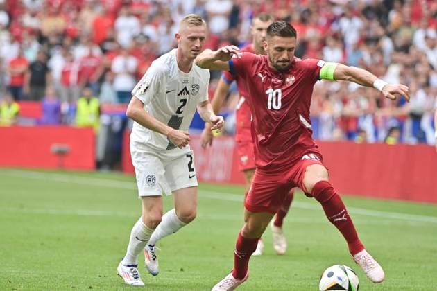 Picture shows from left to right Zan Karnicnik 2, Slovenia , Dusan Tadic 10, Captain Serbia , 20 06 2024, Munich, Soccer, European Championship, Slovenia Serbia, EVENT REGULATIONS PROHIBIT ANY USE OF PHOTOGRAPHS AS IMAGE SEQUENCES AND OR QUASI VIDEO xklx