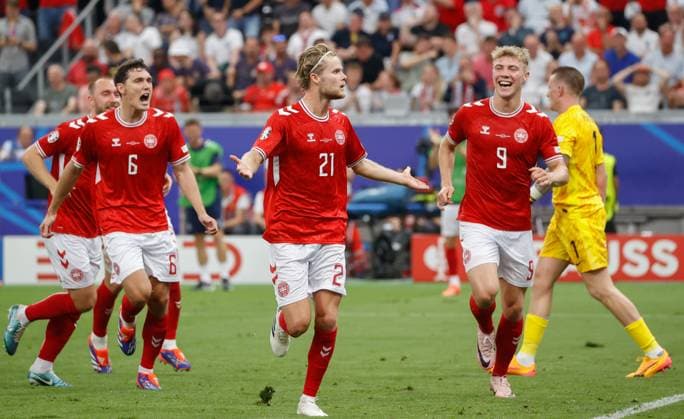 In the picture from left Andreas Christensen Denmark, 6 , goal scorer Morten Hjulmand Denmark, 21 and Rasmus Hojlund Denmark, 9 , cheering, goal to 1 1, 20 06 2024, Denmark vs England, European Championship 2024, Matchday 2, Germany, Frankfurt am Main, Deutsche Bank Park, DFL REGULATES PROHIBIT ANY USE OF PHOTOGRAPHS AS IMAGE SEQUENCES AND OR QUASI VIDEO Copyright: HMBxMedia xJulienxBecker