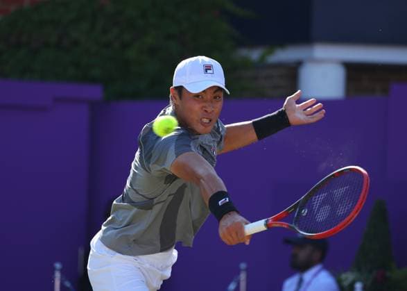 20th June 2024; Cinch Championships, Queens Club, West Kensington, London, England: Cinch Championships Queens Club, Day 4; Brandon Nakashima (USA) with a backhand shot to Lorenzo Musetti (ITA), mens singles match  ActionPlus12657498 JohnxPatrickxFletcher