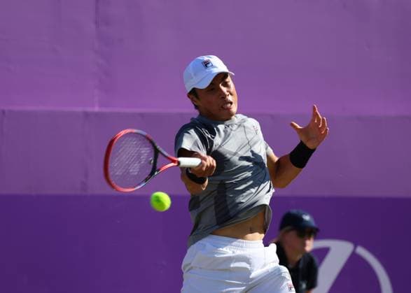 20th June 2024; Cinch Championships, Queens Club, West Kensington, London, England: Cinch Championships Queens Club, Day 4; Brandon Nakashima (USA) with a forehand shot to Lorenzo Musetti (ITA), mens singles match  ActionPlus12657507 JohnxPatrickxFletcher