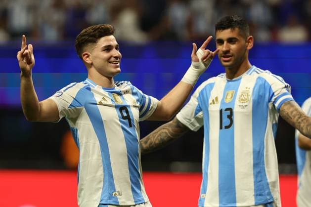 Argentina s forward Julian Alvarez L celebrates with his teammate defender Cristian Romero after scoring the team™s first goal against Canada during the Copa America USA 2024, group A, group stage match between Argentina and Canada, at Mercedes Benz stadium in Atlanta, on June 20, 2024 ATLANTA UNITED STATES Copyright: xALEJANDROxPAGNIx