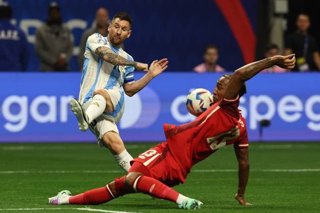 Argentina s forward Lionel Messi L vies for the ball with Canada™s defender Derek Cornelius during the Copa America USA 2024, group A, group stage match between Argentina and Canada, at Mercedes Benz stadium in Atlanta, on June 20, 2024 ATLANTA UNITED STATES Copyright: xALEJANDROxPAGNIx
