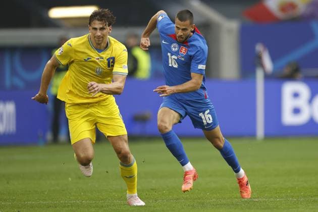 DUSSELDORF, Dusseldorf Arena , 21-06-2024 , European Football Championship Euro2024, Group stage match no.21 between Slovakia and Ukraine, Slovakia player David Hancko and Ukraine player Illia Zabarnyi Slovakia - Ukraine  x25550808x Copyright: