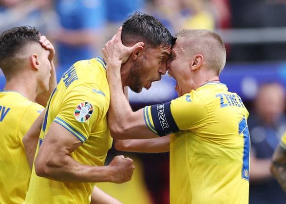 Dusseldorf, Germany, 21st June 2024. Roman Yaremchuk of Ukraine (l) celebrates scoring their second goal past Martin Dubravka of Slovakia with Oleksandr Zinchenko of Ukraine (r) during the UEFA European Championships match at Dusseldorf Arena, Dusseldorf. Picture credit should read: David Klein Sportimage EDITORIAL USE ONLY. No use with unauthorised audio, video, data, fixture lists, club league logos or live services. Online in-match use limited to 120 images, no video emulation. No use in betting, games or single club league player publications. SPI-3201-0078