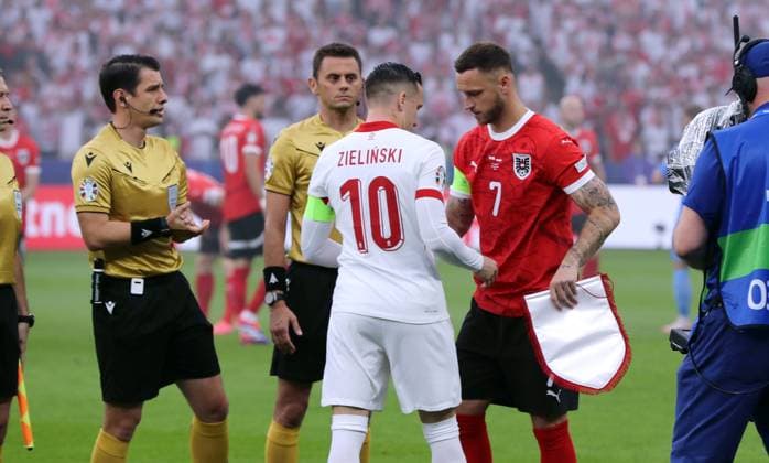 Referees Umut Meler TUR , Piotr Zielinski and Marko Arnautovic at side selection Sport Football Soccer European Championship Euro 2024 European Championship Men Season 2023 2024 21 06 2024 Poland POL vs Austria AUT in Berlin DFL regulations prohibit any use of photographs as image sequences and or quasi video