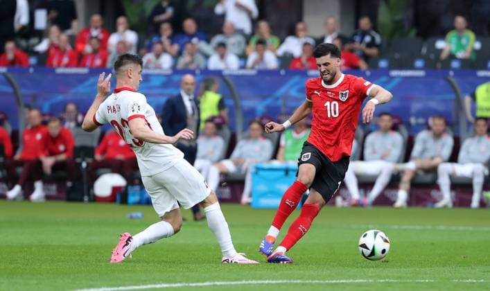 Krzysztof Piatek, Florian Grillitsch duel Match scene Action Sport Football Soccer European Championship Euro 2024 European Championship Men Season 2023 2024 21 06 2024 Poland POL vs Austria AUT in Berlin DFL regulations prohibit any use of photographs as image sequences and or quasi video