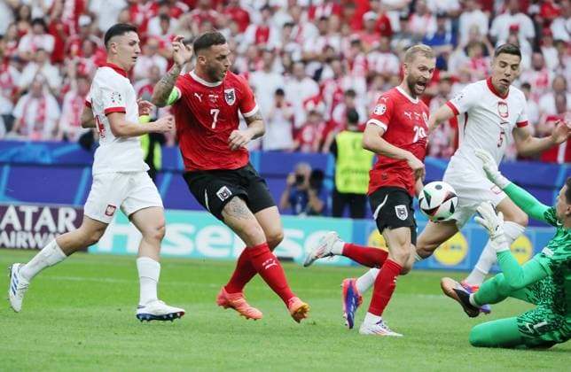 Marko Arnautovic fails against goalkeeper Wojciech Szczesny duel Match scene Action Sport Football Soccer European Championship Euro 2024 European Championship Men Season 2023 2024 21 06 2024 Poland POL vs Austria AUT in Berlin DFL regulations prohibit any use of photographs as image sequences and or quasi video