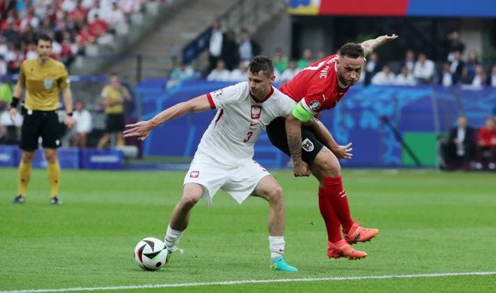 Pawel Dawidowicz in a duel with Marko Arnautovic Sport Football Soccer European Championship Euro 2024 European Championship Men Season 2023 2024 21 06 2024 Poland POL vs Austria AUT in Berlin DFL regulations prohibit any use of photographs as image sequences and or quasi video