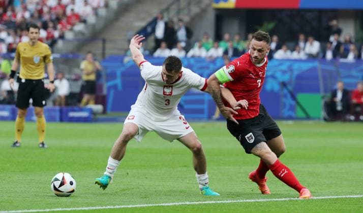 Pawel Dawidowicz in a duel with Marko Arnautovic Sport Football Soccer European Championship Euro 2024 European Championship Men Season 2023 2024 21 06 2024 Poland POL vs Austria AUT in Berlin DFL regulations prohibit any use of photographs as image sequences and or quasi video