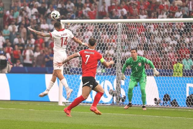 Berlin, Germany, 21 06 2024 Olympiastadion European Championship 2024 soccer, Group D, Poland Austria Jakub Kiwior 14, Poland clears in front of Marko Arnautovic 7, Austria by head, Polands goalkeeper Wojciech Szcz sny 1 looks on Copyright: xdtsxNachrichtenagenturx dts_41133