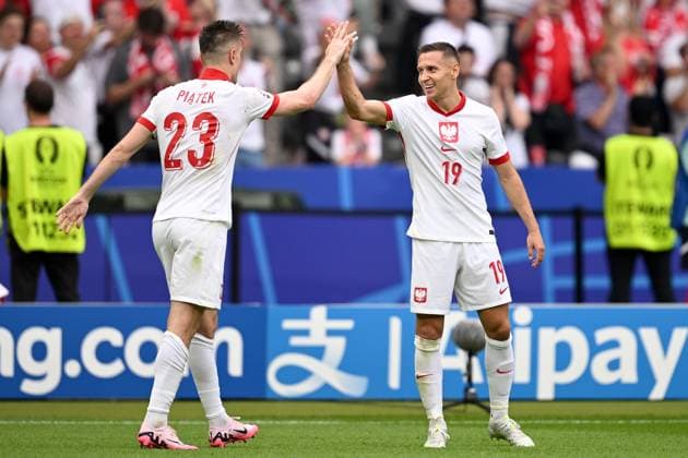 Germany Soccer Euro 2024 Poland - Austria 8713550 21.06.2024 Poland s Krzysztof Piatek celebrates with teammate Przemysaw Frankowski after scoring his team s first goal during the UEFA EURO, EM, Europameisterschaft,Fussball 2024 Group D soccer match between Poland and Austria at the Olympiastadion in Berlin, Germany. Alexey Filippov Sputnik Berlin Germany  Copyright: xAlexeyxFilippovx