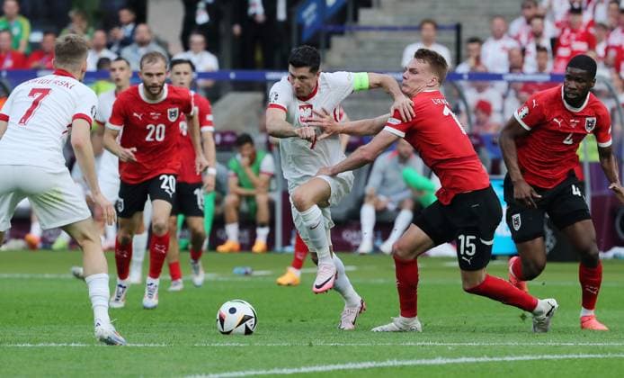 Konrad Laimer in a duel with Piotr Zielinski Sport Football Soccer European Championship Euro 2024 European Championship Men Season 2023 2024 21 06 2024 Poland POL vs Austria AUT in Berlin DFL regulations prohibit any use of photographs as image sequences and or quasi video