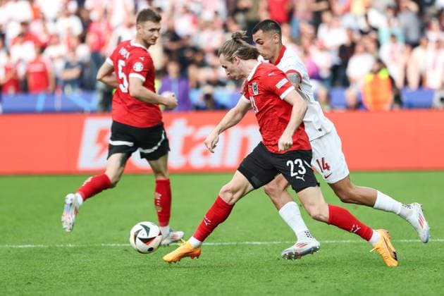 SOCCER - UEFA EURO, EM, Europameisterschaft,Fussball 2024 BERLIN,GERMANY,21.JUN.24 - UEFA EURO 2024, group stage, Austria vs Poland. Image shows Patrick Wimmer (AUT) and Jakub Kiwior (POL).  GEPAxpictures xArminxRauthner