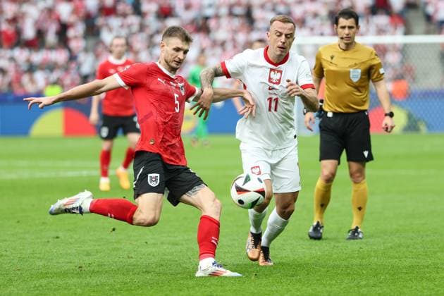 SOCCER - UEFA EURO, EM, Europameisterschaft,Fussball 2024 BERLIN,GERMANY,21.JUN.24 - UEFA EURO 2024, group stage, Austria vs Poland. Image shows Stefan Posch (AUT) and Kamil Grosicki (POL).  GEPAxpictures xArminxRauthner