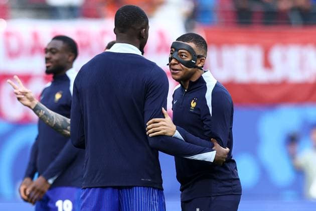 Kylian Mbappà of France wears a face mask during the pre-match warm up after sustaining a broken nose Netherlands v France, UEFA European Championship, EM, Europameisterschaft 2024, Group D, Football, Leipzig Stadium, Leipzig, Germany, 21 Jun 2024 EDITORIAL USE ONLY No use with unauthorised audio, video, data, fixture lists, club league logos or live services. Online in-match use limited to 120 images, no video emulation. No use in betting, games or single club league player publications. Copyright: xMattxWest Shutterstockx 14551682ab