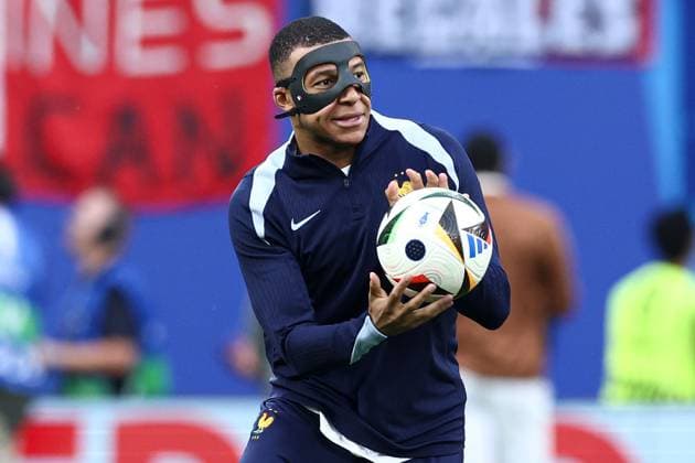 Kylian Mbappà of France wears a face mask during the pre-match warm up after sustaining a broken nose Netherlands v France, UEFA European Championship, EM, Europameisterschaft 2024, Group D, Football, Leipzig Stadium, Leipzig, Germany, 21 Jun 2024 EDITORIAL USE ONLY No use with unauthorised audio, video, data, fixture lists, club league logos or live services. Online in-match use limited to 120 images, no video emulation. No use in betting, games or single club league player publications. Copyright: xMattxWest Shutterstockx 14551682z