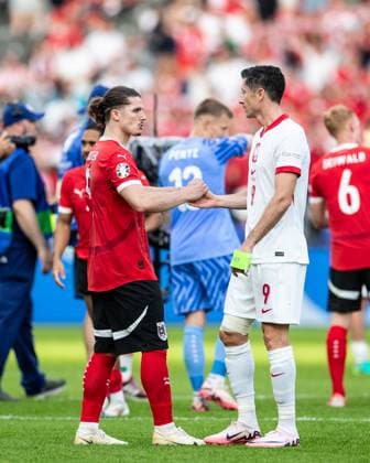 UEFA EURO 2024 Poland Austria 21 06 2024 Robert Lewandowski Poland, 9 , Marcel Sabitzer Austria, 9 after the match UEFA EURO 2024 Poland Austria Olympiastadion, Berlin 21 06 2024 Copyright: xBEAUTIFULxSPORTS Buriakovx