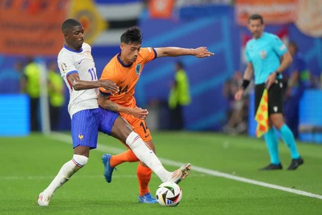 Ousmane Dembele of France fight for the ball with Tijjani Reijnders of the Netherlands during the Euro 2024 soccer match between Netherlands and France at the Leipzig Arena , Leipzig, Germany - Friday 21 June 2024. - Soccer .  Copyright: xSpada LaPressex