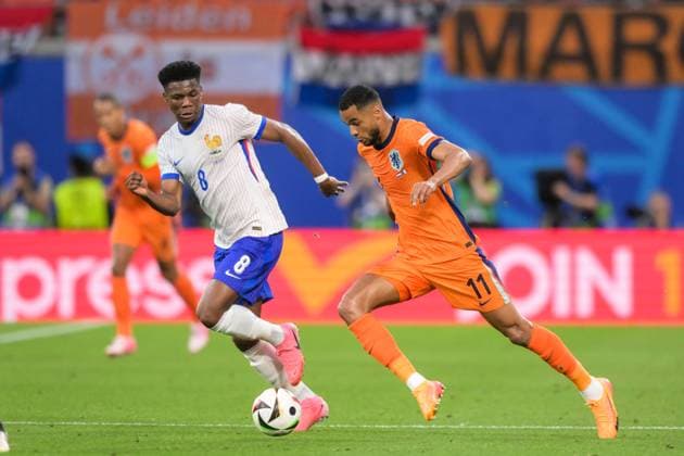 Soccer, UEFA EURO 2024, 20240621, Netherlands France In the picture Aurelien TCHOUAMENI France, 8 and Cody GAKPO Netherlands, 11 Dribbling ball Leipzig Leipzig Stadium Saxony Germany Copyright: Passion2Press MarkusxFischerx