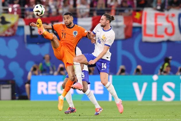 2024-06-21 Netherlands v France - Group D - UEFA EURO, EM, Europameisterschaft,Fussball 2024 LEIPZIG, GERMANY - JUNE 21: Cody Gakpo of the Netherlands battles for the ball with Adrien Rabiot of France during the Group D - UEFA EURO 2024 match between Netherlands and France at Red Bull Arena on June 21, 2024 in Leipzig, Germany. (Photo by Peter Lous BSR Agency) Leipzig Germany Content not available for redistribution in The Netherlands directly or indirectly through any third parties. Copyright: xBSRxAgencyx