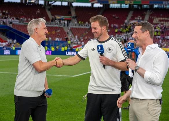 19 06 2024, Football UEFA EURO 2024, preliminary round, match day 2, Germany Hungary, in the Stuttgart Arena After the match, from left Bastian Schweinsteiger, coach Julian Nagelsmann Germany , Alexander Bommes ARD presenter during an interview on the sidelines